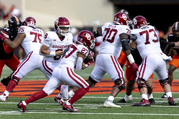 Gordon runs for 137 yards 2 TDs as Oklahoma St. tops No. 10